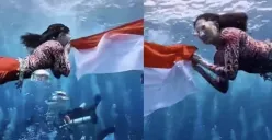Sherly Tjoanda, Gubernur Maluku Utara, mengenakan kostum mermaid merah putih saat mengibarkan bendera di bawah laut Sulamadaha, Ternate, dalam rangka HUT ke-80 Republik Indonesia. (Sumber: TIktok)