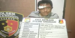 Tampang bonyok perampas uang usai dihajar massa saat mendekam di jeruji besi pesakitan Polsek Cimanggis, Kota Depok. (Sumber: Polsek Cimanggis)