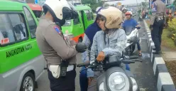 Satlantas Polresta Bogor Kota saat menggelar Operasi Patuh Lodaya di kawasan Jalan Kapten Muslihat Kota Bogor, Selasa, 15 Juli 2025. (Sumber: Poskota/Sekar Putri Andini)