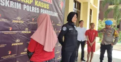 Tersangka SR, seorang ibu rumah tangga jadi pelaku penipuan modus jual minyak goreng diamankan Polres Pandeglang. (Sumber: Poskota/Samsul Fatoni)