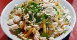 Bubur ayam Barito dengan topping cheese stick khas yang membuatnya berbeda dari bubur biasa. (Sumber: Dok/Pergi kuliner)