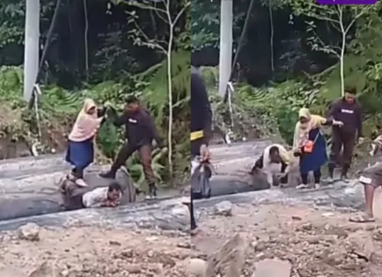 Momen anggota polisi menjadikan punggungnya sebagai jembatan untuk membantu warga menyebrang. (Sumber: Tangkap Layar Instagram/@funnelmedia)