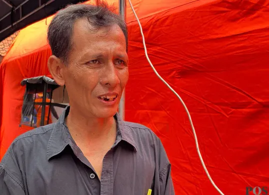 Ketua RT 06 RW 02 Bukit Duri, Fakhri. (Sumber: POSKOTA | Foto: M Tegar Jihad)