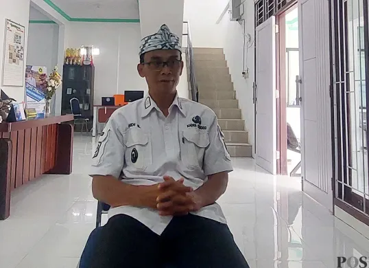 Kepala Desa Cigudeg, Andi Supriadi. (Sumber: POSKOTA | Foto: Sekar Putri Andini)