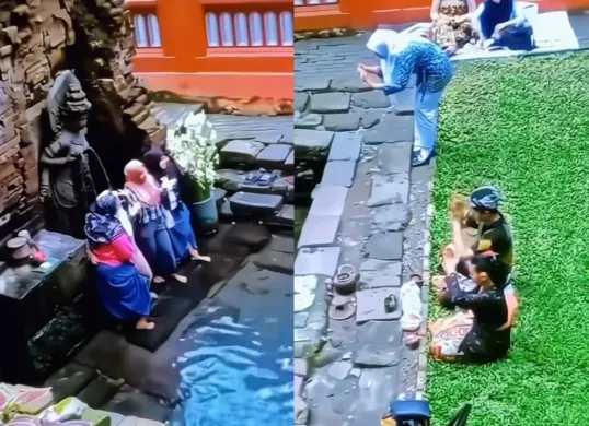 Aksi para Ibu-Ibu yang asyik berfoto di depan arca Candi Belahan Pasuruan saat ada orang yang sedang melakukan sembahyang.