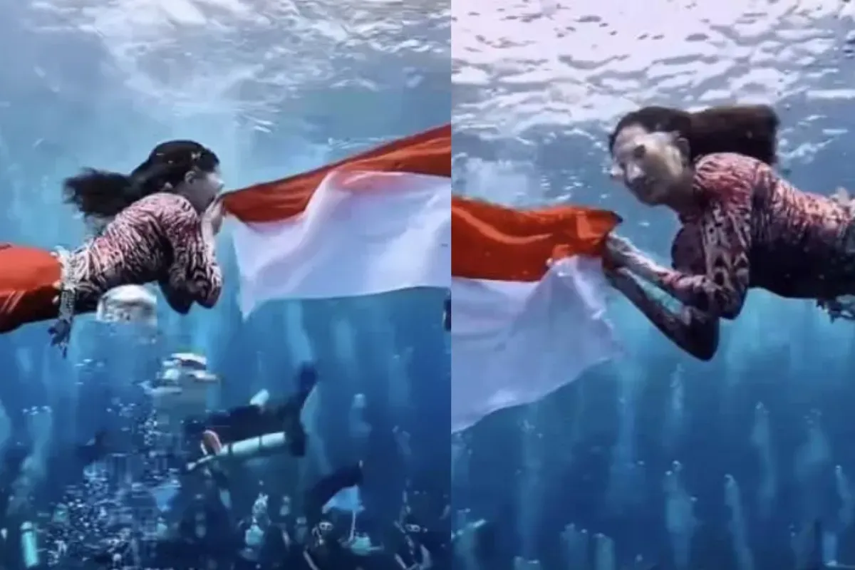 Sherly Tjoanda, Gubernur Maluku Utara, mengenakan kostum mermaid merah putih saat mengibarkan bendera di bawah laut Sulamadaha, Ternate, dalam rangka HUT ke-80 Republik Indonesia. (Sumber: TIktok)