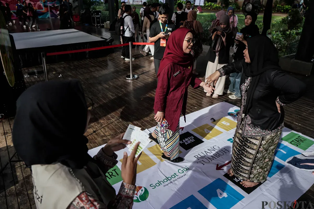 Warga mencoba salah satu permainan pada pagelaran Jakarta Future Festival 2025: Collaborate to Elevate! di Taman Ismail Marzuki, Jakarta, Jum'at, 13 Juni 2025. Pemprov DKI Jakarta menggelar Jakarta Future Festival hingga 15 Juni 2025. (Sumber: Poskota/Bilal Nugraha Ginanjar)