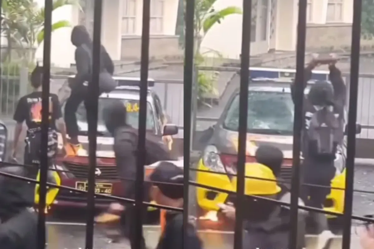 Mobil polisi dibakar massa saat aksi peringatan hari buruh internasional atau May Day di Bandung. (Sumber: Tangkap Layar Instagram/@jabodetabek24info)