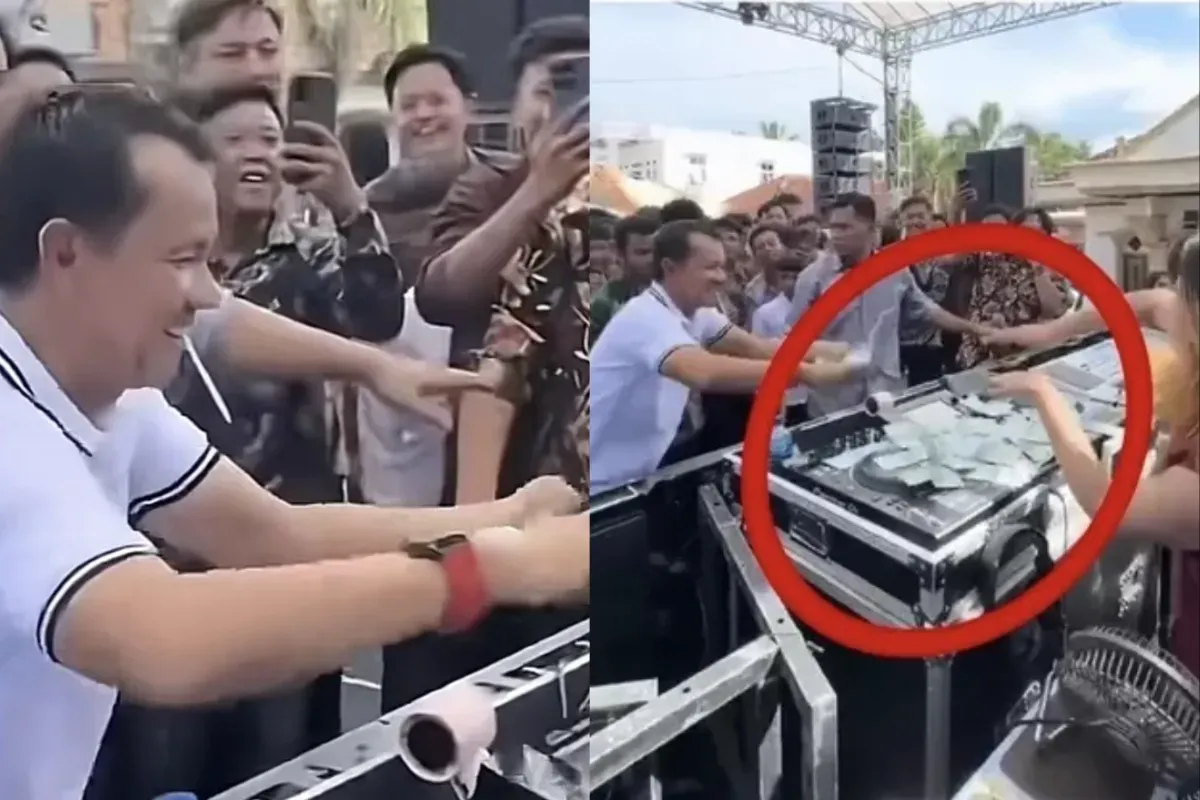 Tangkapan layar video yang memperlihatkan Hatami, anggota DPRD Lampung Utara, sedang menyawer DJ Rere Monique dengan pecahan Rp50 ribu di acara khitanan. Aksi tersebut menuai kritik publik. (Sumber: X/@ilhampid)