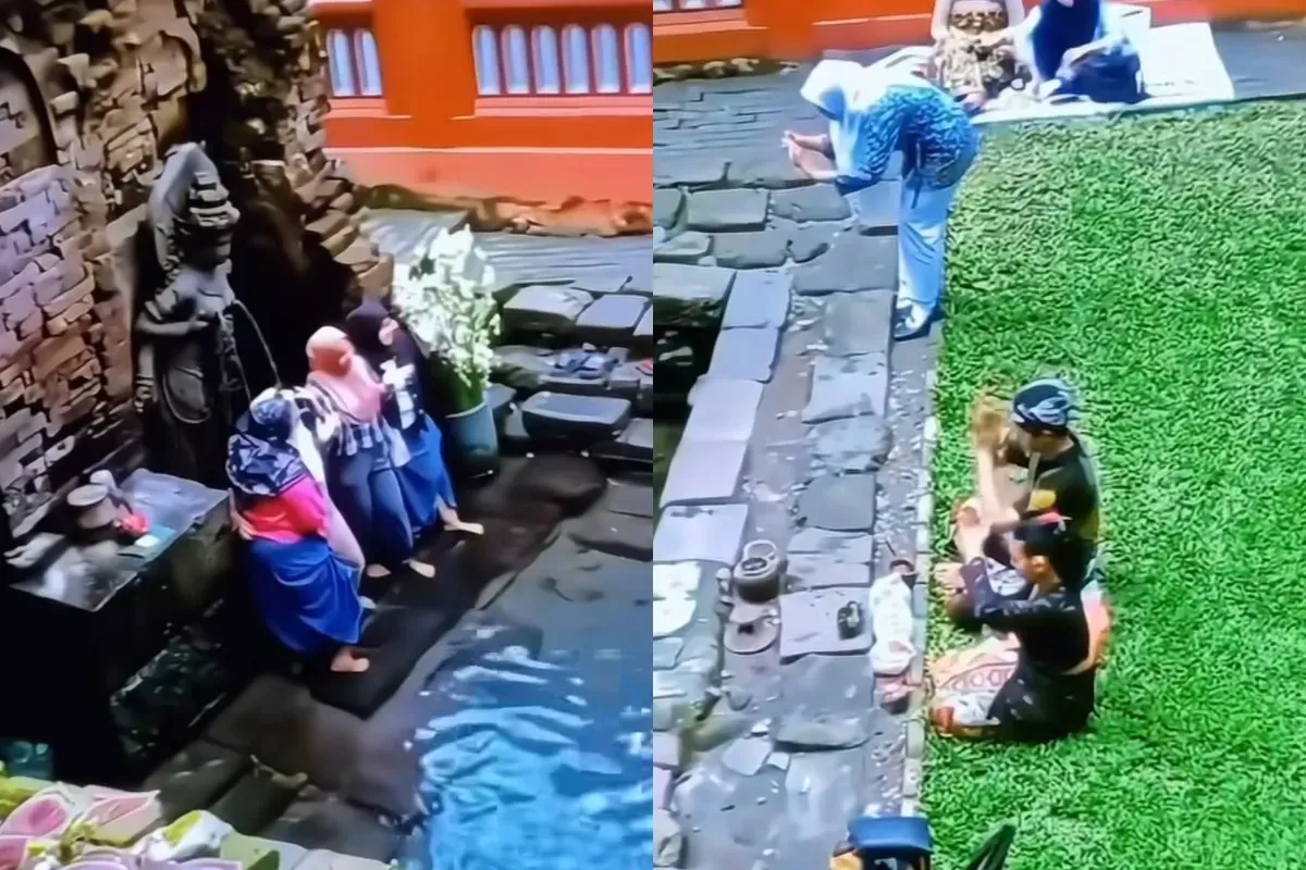 Aksi para Ibu-Ibu yang asyik berfoto di depan arca Candi Belahan Pasuruan saat ada orang yang sedang melakukan sembahyang.