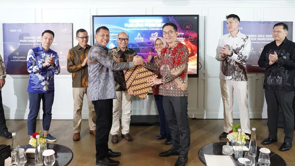 TelkomMetra menandatangani Perjanjian Jual Beli dengan kelompok perusahaan Fullerton Health terkait divestasi penuh atas AdMedika. (Sumber: Dok. Telkom)