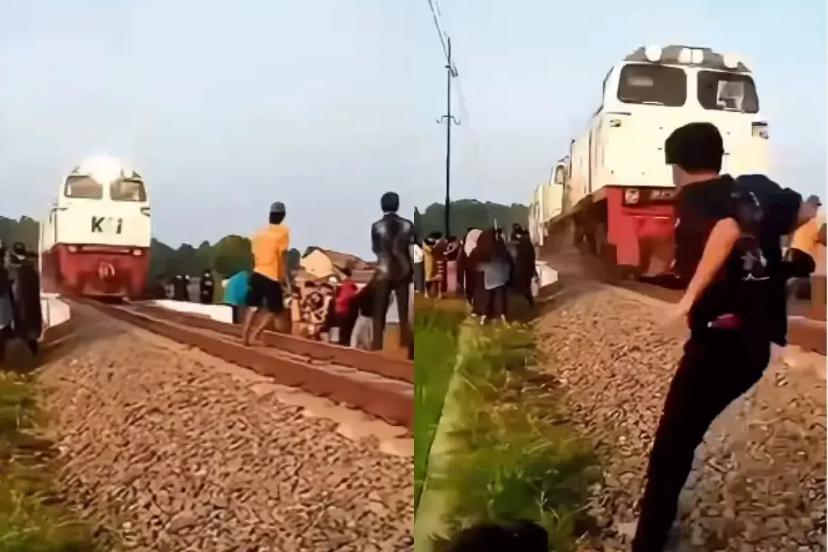 Aksi berbahaya para pemuda yang menantang kereta api di perlintasan. (Sumber: Tangkap Layar Instagram/@fakta.indo)
