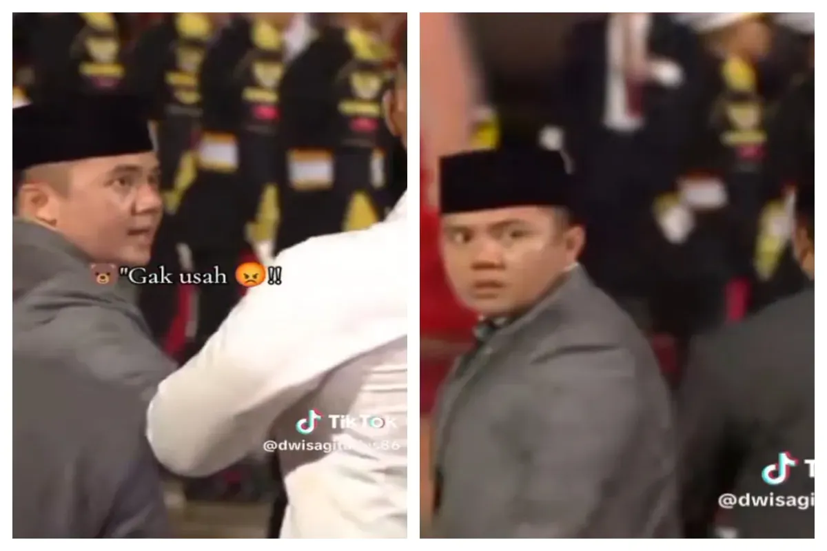 Sekretaris Kabinet (Seskab) Mayor Teddy Indra Wijaya saat anggota Pasukan Pengamanan Presiden (Paspampres) yang sedang memayungi Presiden RI Prabowo Subianto. (Sumber: X/@Intel_Imut)