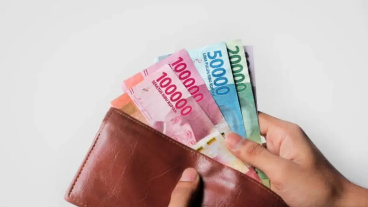Aplikasi penghasil uang ini beri pengguna penghasilan tambahan saldo DANA gratis (Sumber: Getty Images/Dicky Algofari)