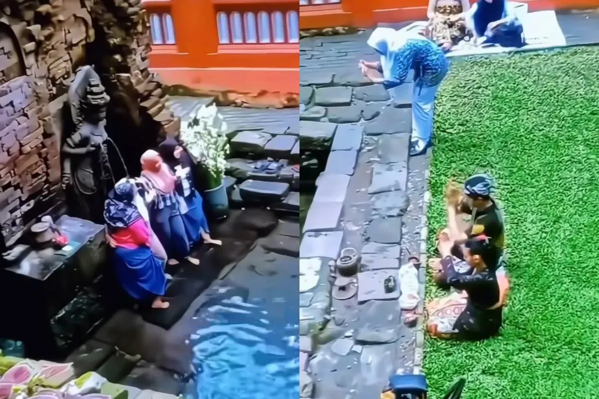 Aksi para Ibu-Ibu yang asyik berfoto di depan arca Candi Belahan Pasuruan saat ada orang yang sedang melakukan sembahyang.