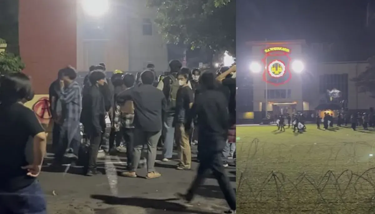 Ratusan demonstran menggelar aksi malam di Mapolda DIY menuntut aparat bertindak humanis. Aksi sempat ricuh dengan perusakan pagar dan coretan protes. (Sumber: Instagram/@gejayanmemanggil)