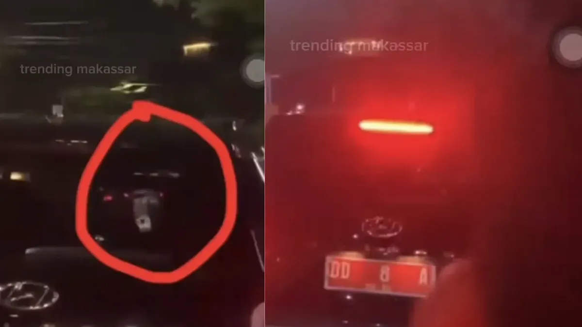 Tangkapan layar video viral yang memperlihatkan mobil berpelat merah diduga milik pejabat Sulsel terekam sedang memainkan judi online di jalan raya. (Sumber: Threads/@trending_makassar)