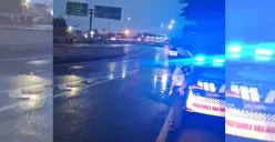 Seorang petugas kepolisian dengan rompi keselamatan terlihat berdiri di samping kendaraan patroli, mengawasi arus lalu lintas dari arah Layang MBZ menuju Gerbang Tol Cikunir 8. (Sumber: X/@TMCPoldaMetro)