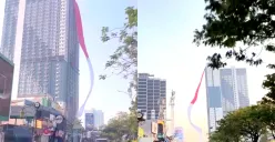 Potret bendera Merah Putih raksasa yang berkibar di gedung tinggi yang berada di wilayah Depok. (Sumber: Instagram/@depok24jam)