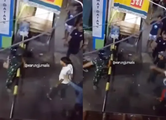 Momen seorang anggota TNI melerai tawuran antar pemuda di Jakarta Timur hanya mengandalkan selang air. (Sumber: Tangkap Layar Instagram/@warungjurnalis)