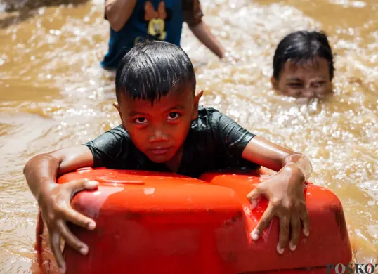 Ilustrasi banjir Jakarta. (Sumber: Poskota/Bilal Nugraha Ginanjar)