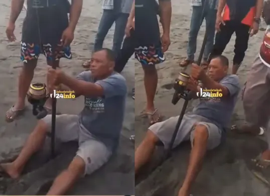 Momen seorang pemancing berupaya menyelamatkan wisatawan yang terseret ombak di Pantai Ketawang. (Sumber: Tangkap Layar Instagram/@jabodetabek24info)