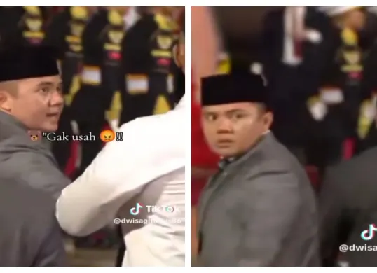 Sekretaris Kabinet (Seskab) Mayor Teddy Indra Wijaya saat anggota Pasukan Pengamanan Presiden (Paspampres) yang sedang memayungi Presiden RI Prabowo Subianto.  (Sumber: X/@Intel_Imut)