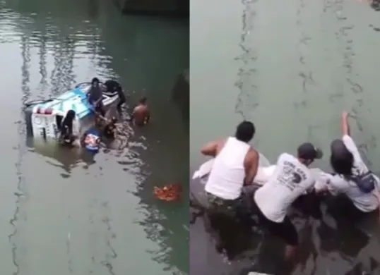 Ambulans pengantar jenazah jatuh ke dalam sungai di Bali. Warga bergotong royong untuk mengevakuasi. (Sumber: Tangkap Layar Instagram/@fakta.beriita)