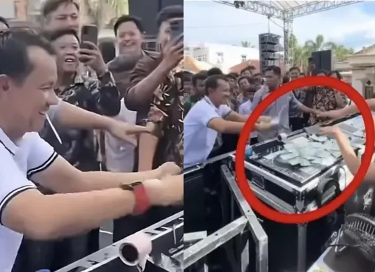 Tangkapan layar video yang memperlihatkan Hatami, anggota DPRD Lampung Utara, sedang menyawer DJ Rere Monique dengan pecahan Rp50 ribu di acara khitanan. Aksi tersebut menuai kritik publik. (Sumber: X/@ilhampid)