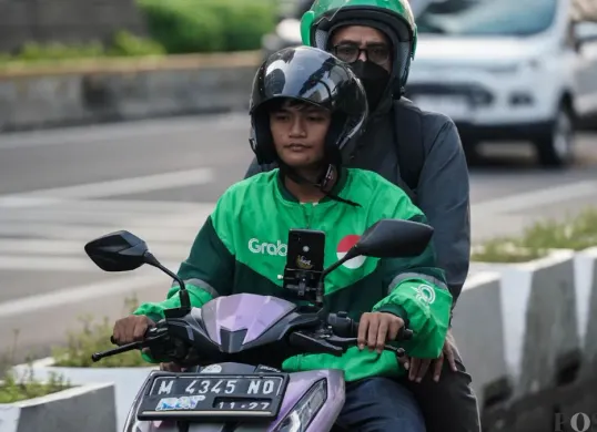 Kebijakan pemberian BHR Ojol 2026. (Sumber: Poskota/Bilal Nugraha Ginanjar)