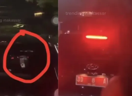 Tangkapan layar video viral yang memperlihatkan mobil berpelat merah diduga milik pejabat Sulsel terekam sedang memainkan judi online di jalan raya. (Sumber: Threads/@trending_makassar)
