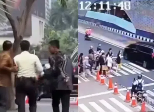 Momen saat mobil Alphard menerobos lampu merah di Bundaran HI dan satpam yang diduga diintimidasi karena menegur pengemudi. (Sumber: Instagram/@jabodetabek24info)