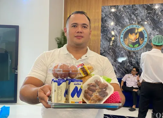 Kepala SPPG Pangauban, Hendrik Irawan. (Sumber: Poskota/Gatot Poedji Utomo)